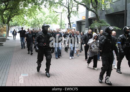 Bratislava, Slovakia. 20th June, 2015. Slovakian people, escorted by riot police, take part in a protest against immigrants in Bratislava, Slovakia, June 20, 2015. Two policemen were injured and at least 10 Slovaks were arrested as some 6,000 people protested against immigrants in Bratislava on Saturday. Credit:  Erik Adamson/Xinhua/Alamy Live News