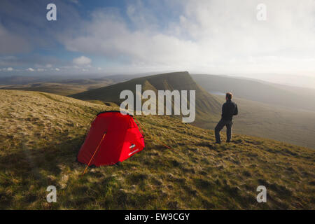 Hillwalker wild camping on Fan Foel. The Black Mountain. Brecon Beacons National Park. Carmarthenshire. Wales. UK. Stock Photo