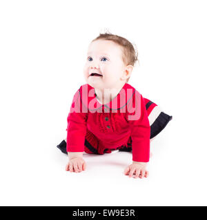 Funny crawling baby girl in a red dress Stock Photo