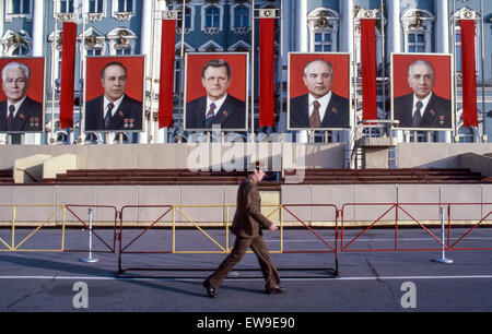 April 30, 1984 - Leningrad, Russia - A Soviet soldier walks by the Winter Palace, part of the Hermitage Museum, in the Palace Square, the central city square of Leningrad (St. Petersburg), decorated for the annual May Day Parade with reviewing stands and portraits of the Central Committee of the Communist Party of the USSR. At left is Konstantin Chernenko the fifth General Secretary of the Communist Party who led the USSR from February 1984 until his death in March 1985. Second from right is Mikhail Gorbachev who was eighth and last leader of the USSR. (Credit Image: © Arnold Drapkin/ZUMA Wire Stock Photo