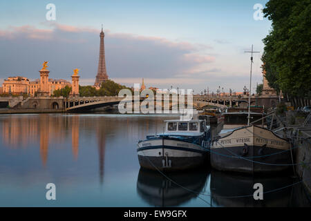 Dawn over river boats, Pont Alexandre III, Eiffel Tower and River Seine, Paris, France Stock Photo
