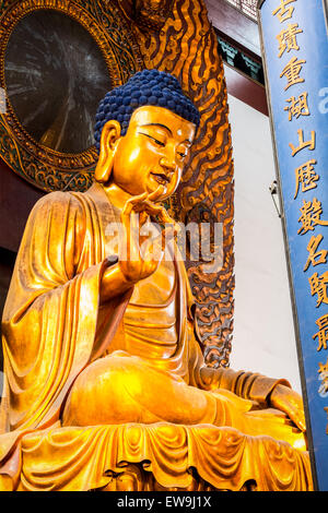 Golden Buddha in Lingyin Temple at West Lake, Hangzhou, China Stock Photo