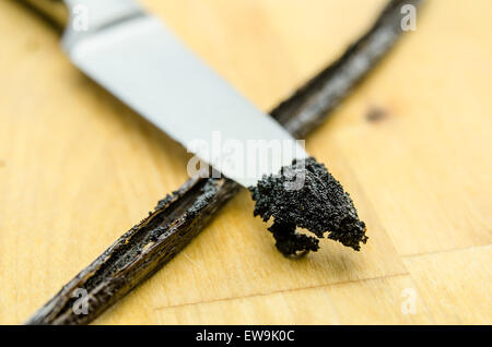 Freshly scraped vanilla beans on a kitchen knife Stock Photo