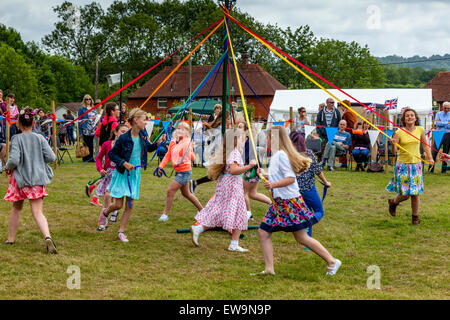 Children dancing around the Maypole at a summer fair in Dulwich park ...