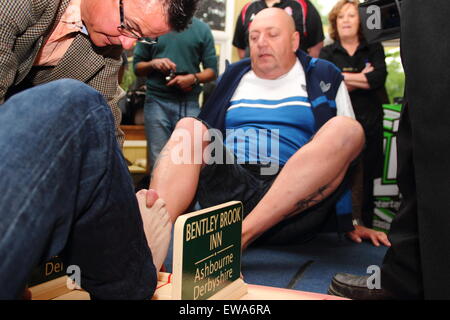 Competitors battle it out at the World Toe Wrestling Championships, Fenny Bentley, Derbyshire England UK Stock Photo