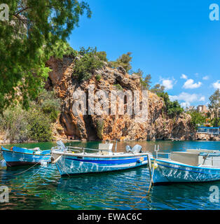 Boats on Lake Voulismeni. Agios Nikolaos, Crete, Greece Stock Photo