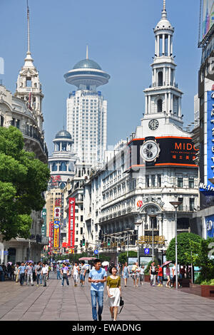 Visitors at Nanjing Road. Main shopping street of Shanghai. One of the busiest shopping streets in the world . East Nanjing Road Stock Photo