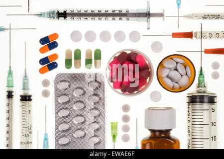 Selection of prescription drugs and  syringes used by doctors in the treatment of illness and disease. Stock Photo