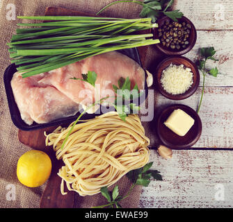Cooking Ingredients With Chicken Fillets And Pasta Stock Photo
