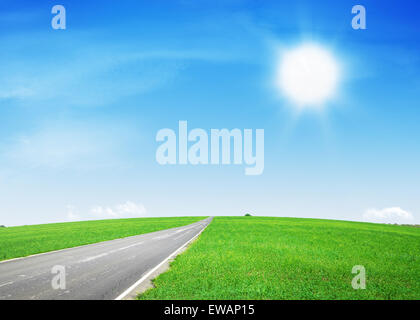 asphalt road through the green field Stock Photo - Alamy