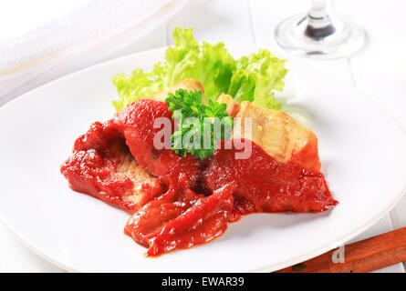 White fish fillets in rich tomato sauce Stock Photo