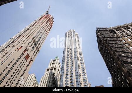 Skyscrapers with crane and Woolworth Building, in New york seen from below, NYC, Manhattan, United states. Stock Photo