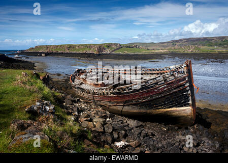 A single abandoned fishing boat at low tide on the banks of Loch a' Chumbainn Croig Isle of Mull Inner Hebrides Argyll Scotland Stock Photo