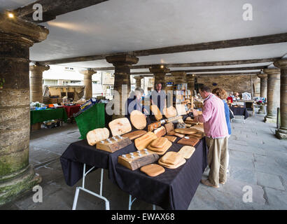 Craft stall selling wooden products in the pillared Market House, Tetbury, a small town in the Cotswolds, Gloucestershire, UK Stock Photo