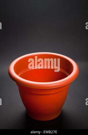 Empty flower pot isolated on dark background Stock Photo