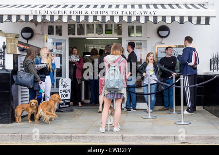 Customers queuing at the Take Away counter at the famous Magpie Café in Whitby North Yorkshire Stock Photo