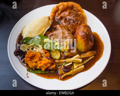 Sunday Lunch main course Roast Beef Yorkshire pudding vegetables and gravy Stock Photo