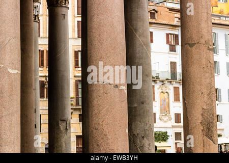 Windows of historical building thorough the columns of the Pantheon in the center of Rome Stock Photo