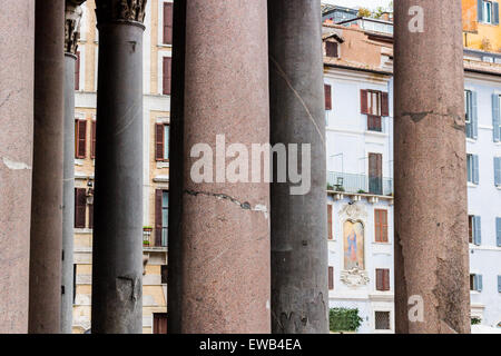 Windows of historical building thorough the columns of the Pantheon in the center of Rome Stock Photo