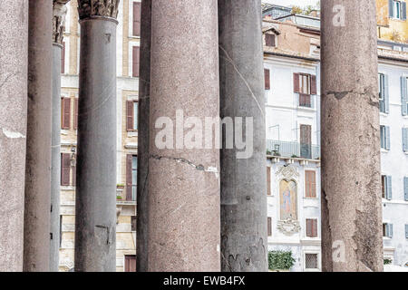Windows of historical building thorough the columns of the Pantheon in the center of Rome Stock Photo