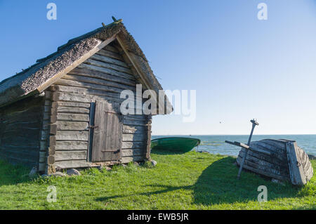 Rural fisherman utility house and boats at sea coast Stock Photo