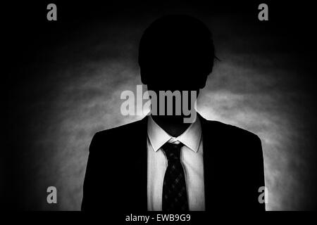 Man standing in the dark Stock Photo