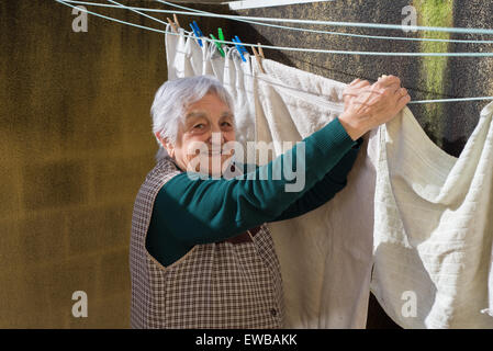 Elderly woman hanging out sexy underwear Stock Photo - Alamy