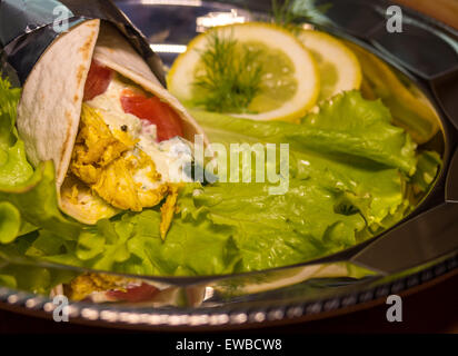 Kebab - grilled vegetables with chicken in curry sauce Stock Photo