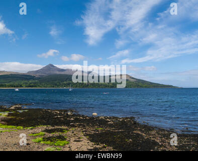 View across Brodick Bay in Firth of Clyde to Goatfell highest part of  Isle of Arran Scotland on a lovely May day weather blue sky Stock Photo