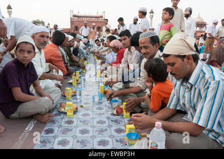 Traditional Iftar (fast-breaking) at Jama Masjid during Ramadan. Old Delhi, India. Stock Photo