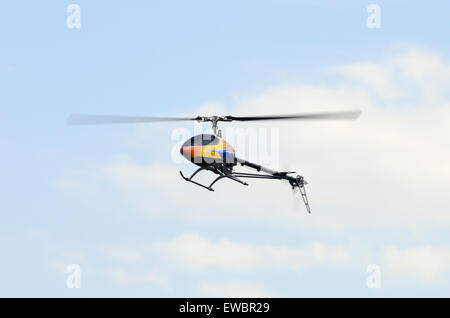 Flying remote controlled helicopter Stock Photo