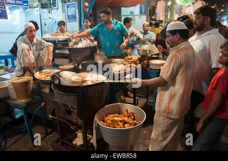 Men cooking in a local restaurant in Chandni Chowk, Old Delhi, India during Ramadan/ Ramzan.