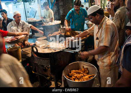 Men cooking in a local restaurant in Chandni Chowk, Old Delhi, India during Ramadan/ Ramzan.