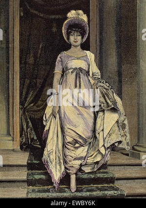 France. First Empire. 1804-1820. Woman dressed to the Empire style. Engraving. Color. 19th century. Stock Photo