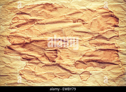 Old creased stained paper background or texture, space for text. Stock Photo