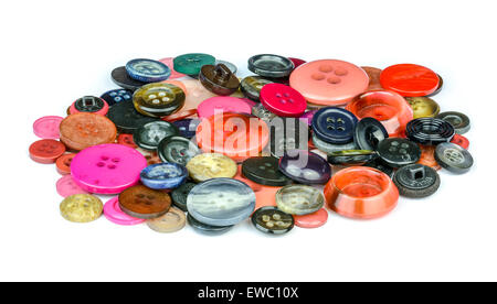 A pile of mixed sized multicoloured buttons on a white background. Stock Photo