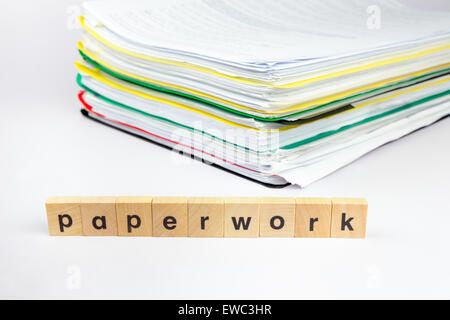 Stack of papers with word paperwork on wooden blocks Stock Photo