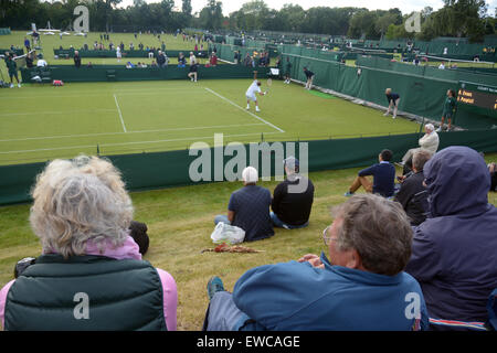 Wimbledon, London, UK. 22nd June, 2015. Bank of England Sports Grounds Roehampton London England 22nd June 2015. Spectators enjoying Wimbledon qualifying. The qualifying competition for The Championships began today - a week before the main event. there is no single 'winner' of Qualifying, instead the players who win all three rounds - 16 in the Gentlemen's Singles and 12 in the Ladies' Singles - will progress, along with four pairs in each of the Ladies' and Men's Doubles events. Credit:  mainpicture/Alamy Live News Stock Photo