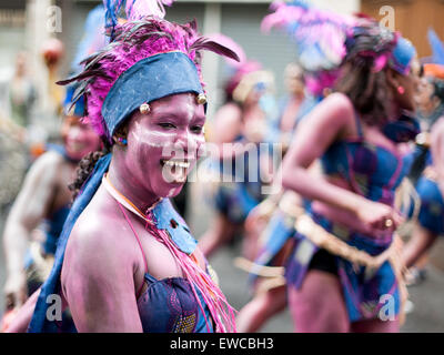 Paris, France - July 7, 2012: Female dancers performing on streets of Paris at the annual summer tropical carnival. Stock Photo