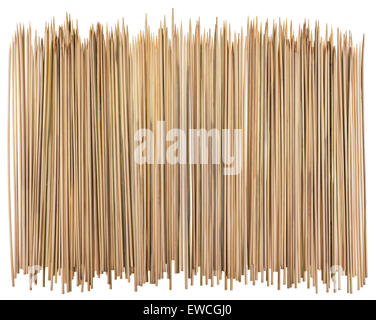 Sharp round yellow bamboo sticks for a barbecue big border. Isolated on white Stock Photo