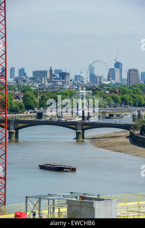 Developers cranes border a view Thames towards the City with  London Eye and the financial district in the distance Stock Photo