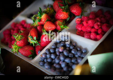 A selection of berries at Easter on a dining table Stock Photo