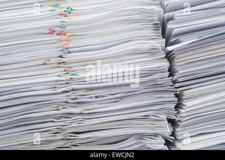 Pile of documents on desk stack up high Stock Photo