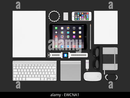 Varna, Bulgaria - February 10, 2015: Top view of Apple products mockup. Consists of ipad air 2, iphone 5s, keyboard, smartwatch Stock Photo