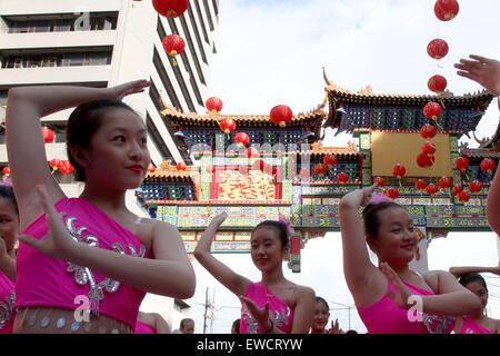 Manila, Philippines. 23rd June, 2015. Students dance during the unveiling of the new Chinatown Friendship Arch in Manila, the Philippines, June 23, 2015. Credit:  Rouelle Umali/Xinhua/Alamy Live News Stock Photo