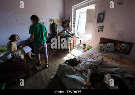 Two teenagers in a messy bedroom Stock Photo