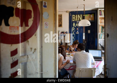Three people studying at the Real Republica Rás Teparta - typical student housing in Coimbra, Portugal Stock Photo