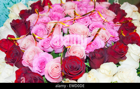 Pink faded roses bouquet with leaves Stock Photo