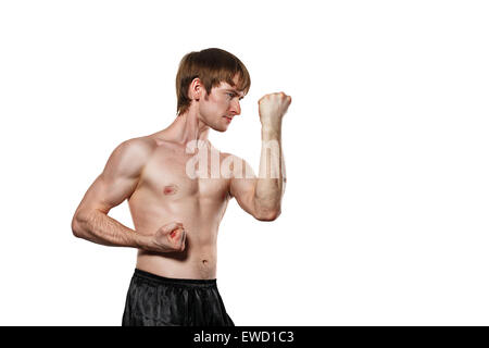The man trains kata kung fu block the blow. Isolated on white background. The concept of masculine strength Stock Photo