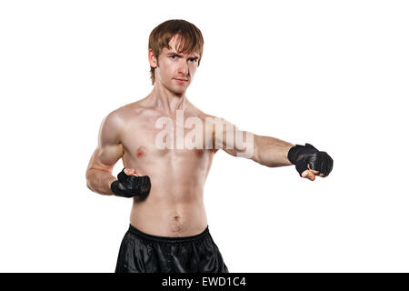 Male fighter in mixed martial fighting gloves kick. Isolated on white background. Healthy lifestyle concept. Stock Photo